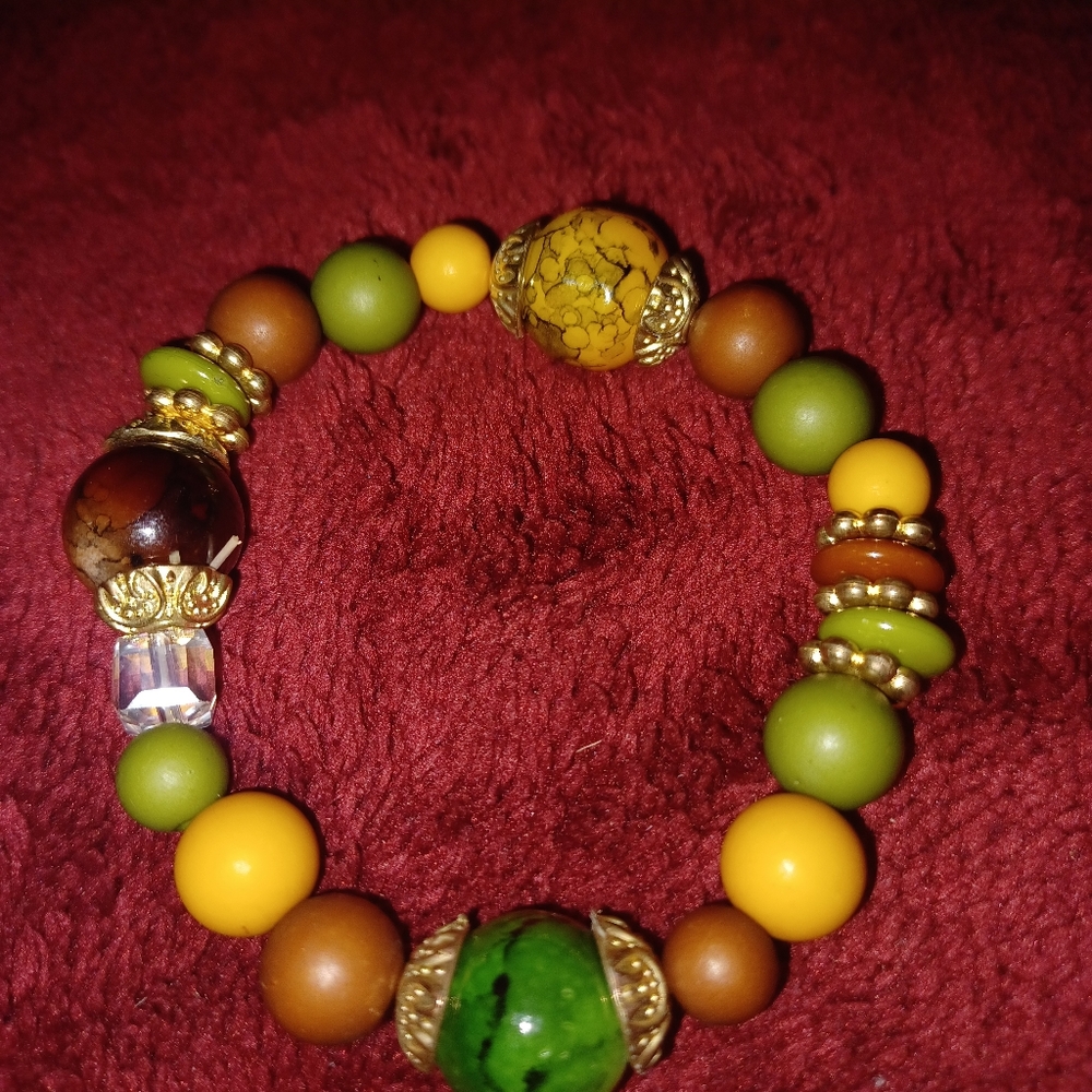 Green and Yellow Beaded Bracelet with Intricate Patterns